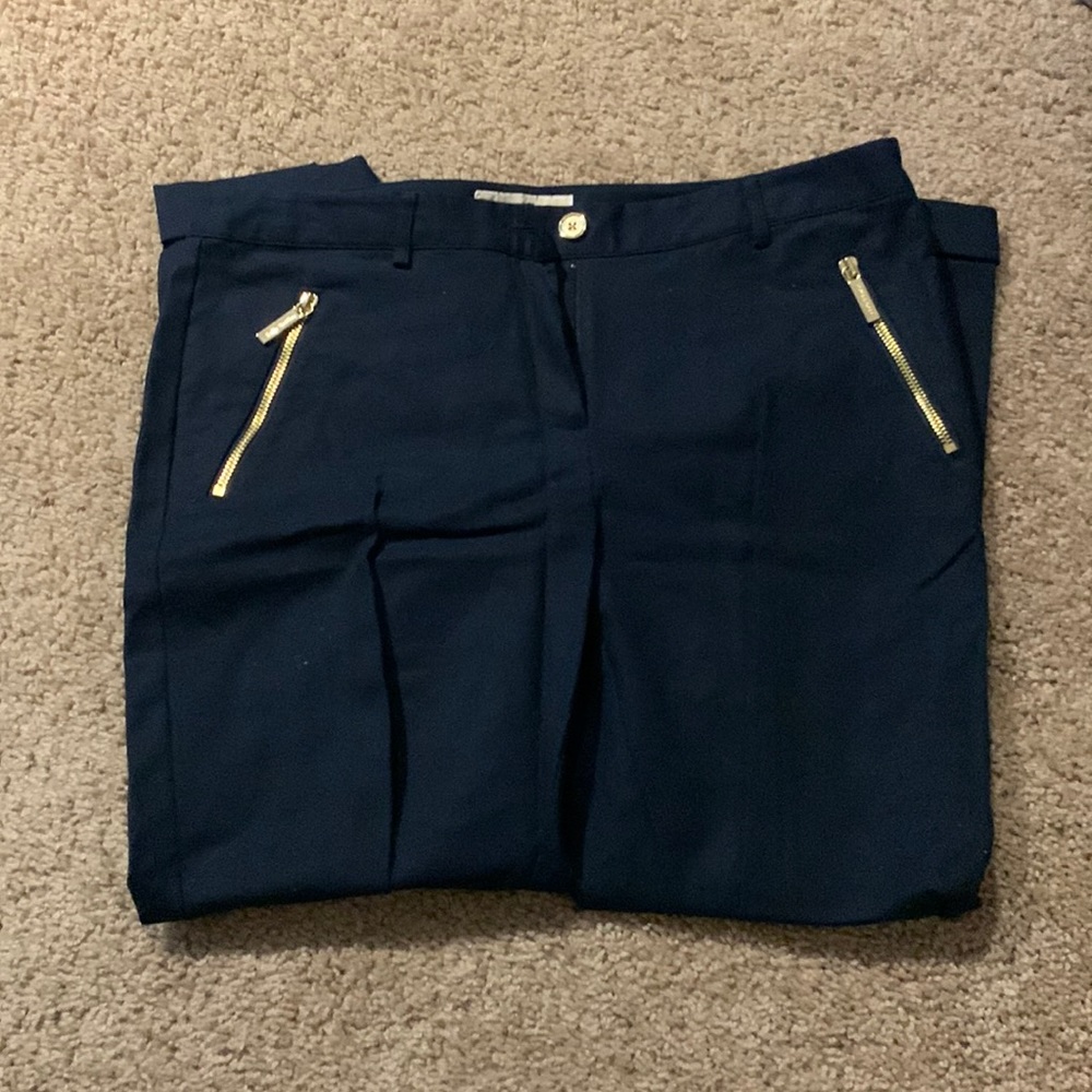 Navy blue trousers, gold accents